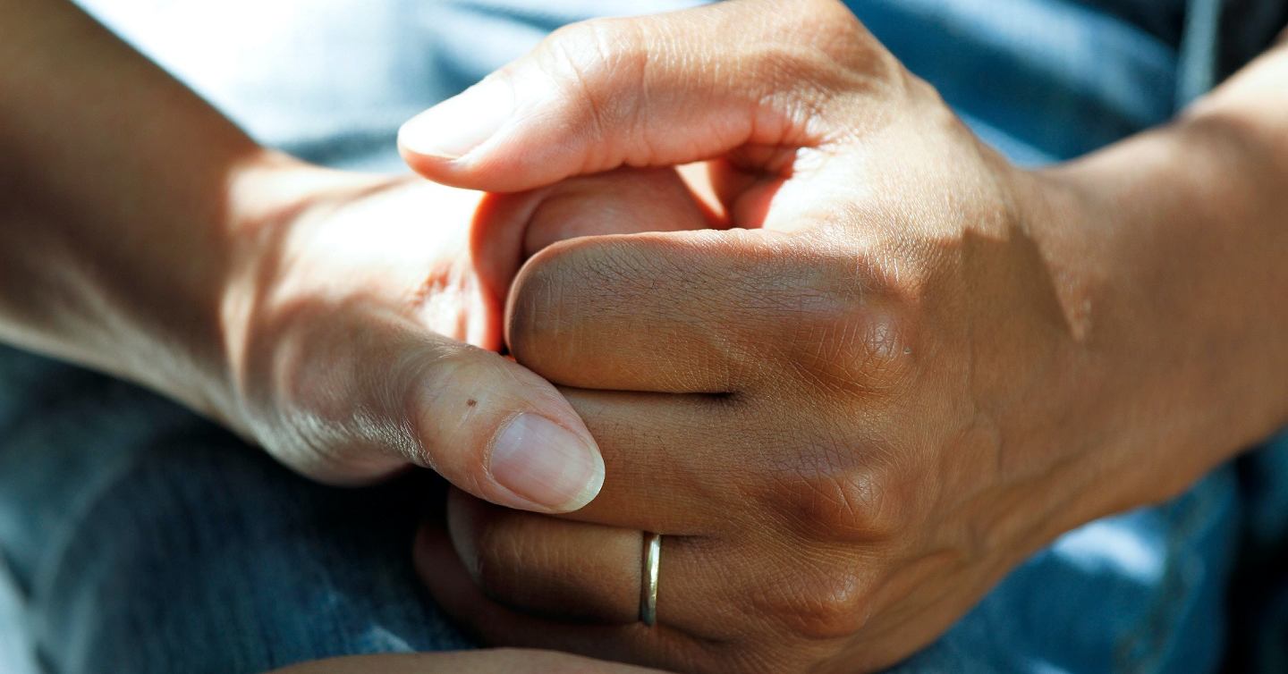 hands holding each other close up photo