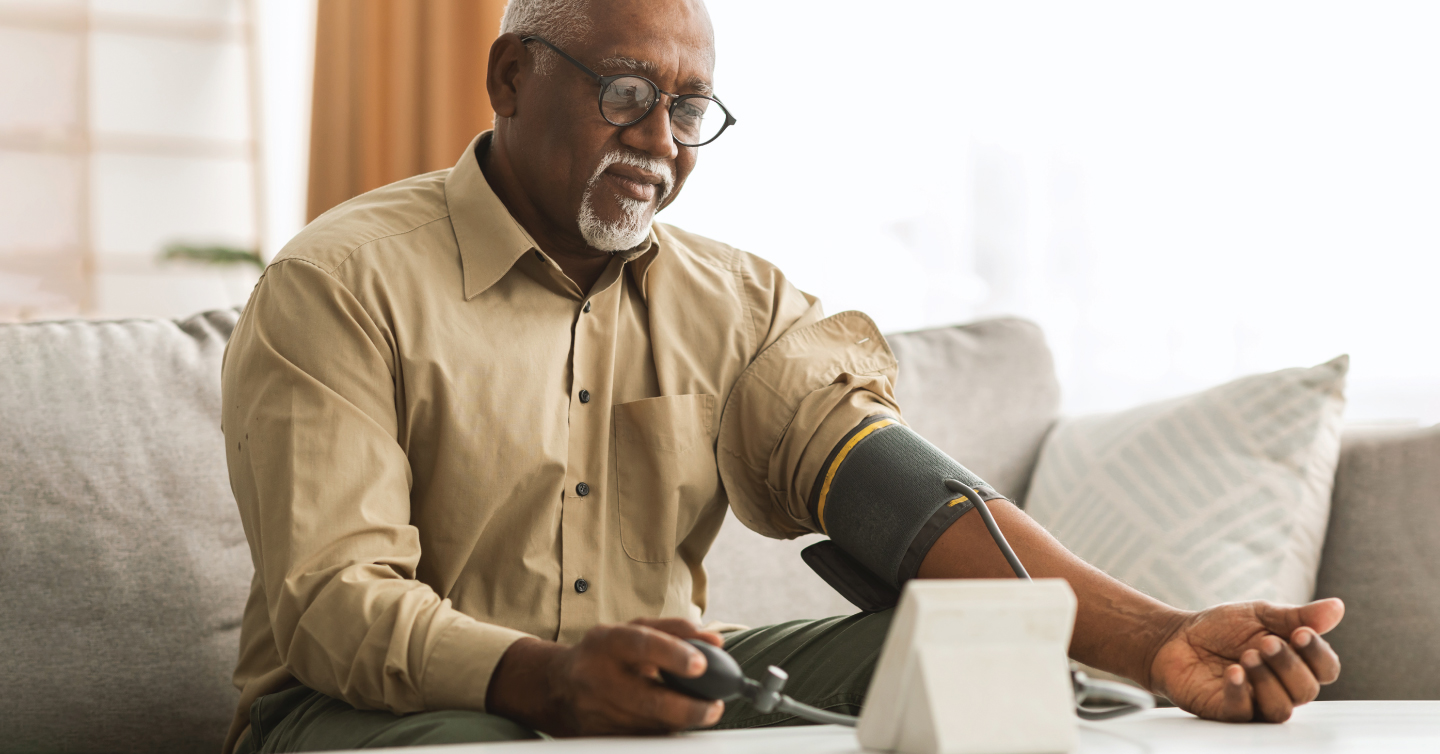 a man checking his blood pressure at home