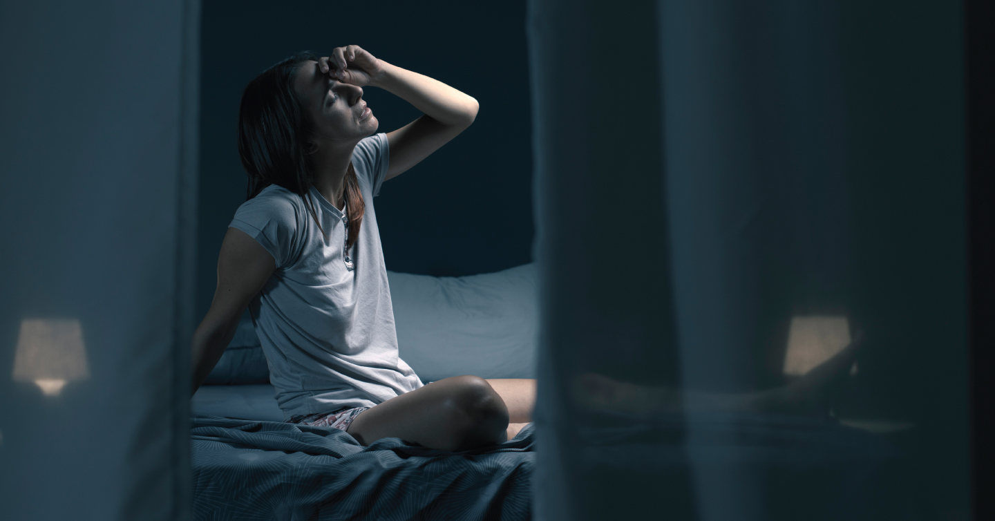 a person struggling to sleep due to warm temperatures