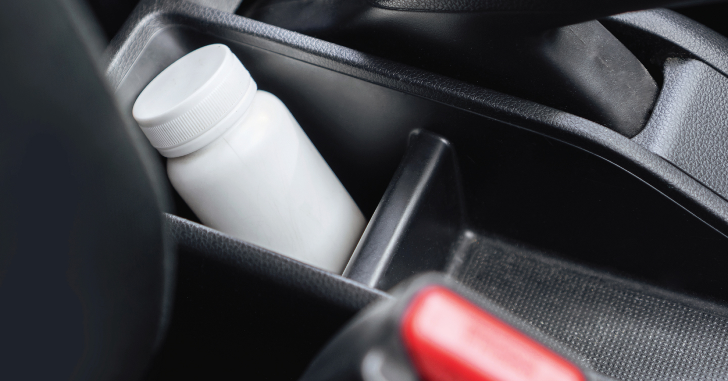 a bottle of pills in a warm car