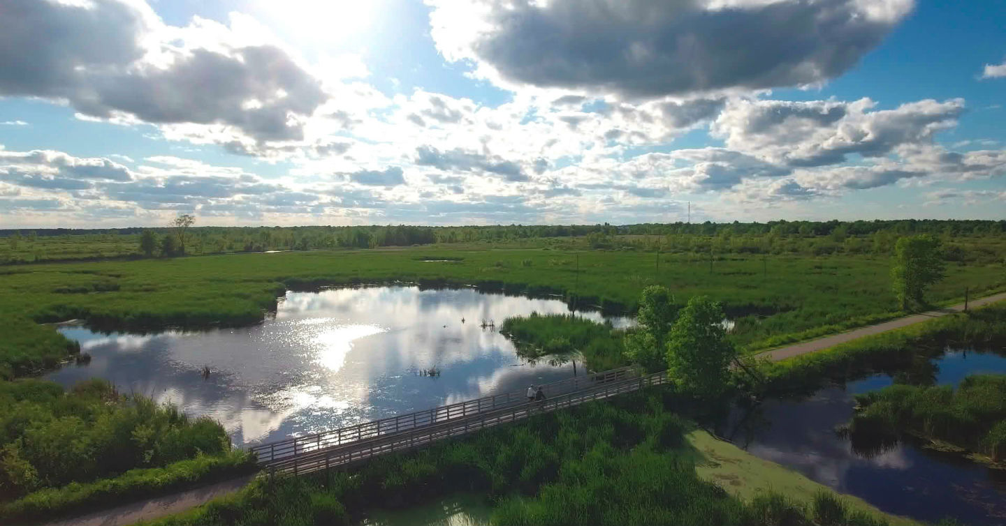 aerial shot of bridge and lake which suggests lower stress