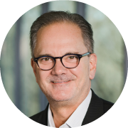 circular headshot of dr gregory brusko